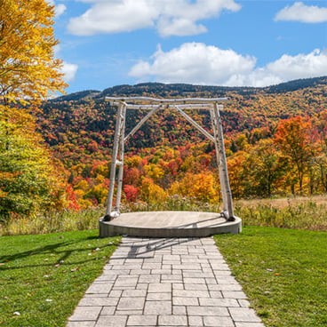 A wedding overlooking slopeside foliage at the Jordan Bowl